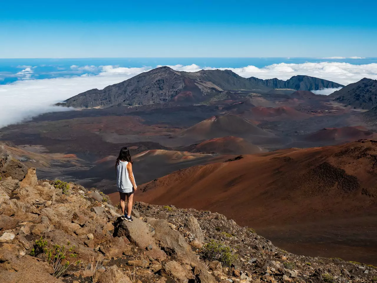 woman standing on a mountain top